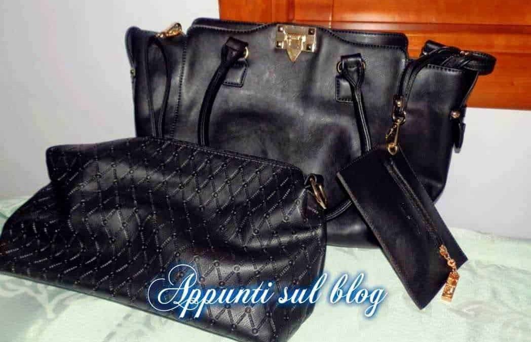 Borsa in pelle nera con tracolla e portafoglio coordinato, accessori moda eleganti e di alta qualità, ideali per un look sofisticato e alla moda.
