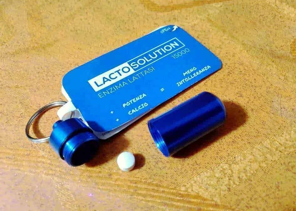 Lattosolution in pill form with container and keychain for calcium and enzyme supplementation, designed for sport and health maintenance.