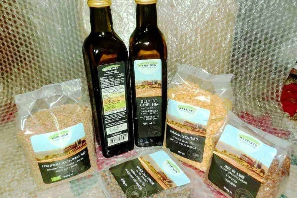 Olio di camelinina e legumi biologici da agricoltura sostenibile, perfetti per condire piatti salutari e naturali, ideali per cucina vegana e ricette nutrienti.