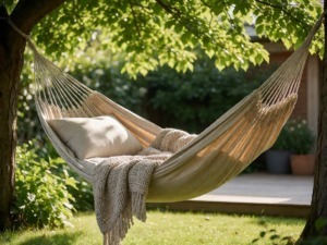 Relaxing in a stylish hammock in a lush garden setting, two women enjoying a peaceful moment outdoors, perfect for leisure and relaxation.