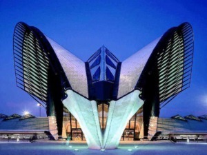 Filtro, architettura moderna, edificio futuristico, design innovativo, skyline urbano notturno.