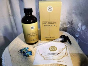 Bioniva anticellulite: BioNiva olio massaggi anticellulite naturale, bottiglia da 236ml con confezione, ideale per trattamento cellulite, con applicatore in siringa, integrato con foglio esplicativo e decorazioni floreali.