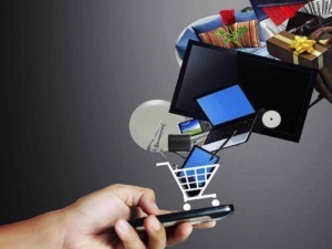 Cestino della spesa digitale con dispositivi elettronici e regali, rappresenta lo shopping online e le offerte digitali.