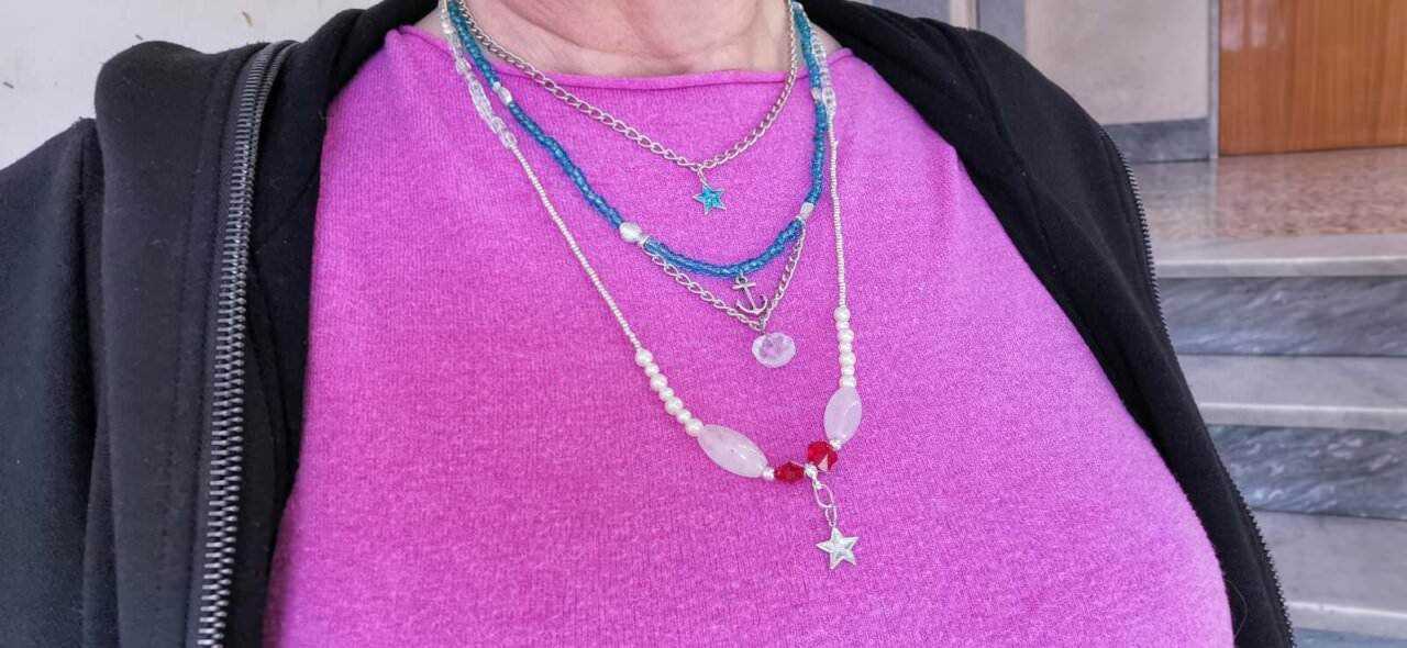 Love Create Me: Colorful layered necklaces with star and anchor charms, stylish streetwear fashion, casual accessories, pink top and black jacket, trendy jewelry for women, fashion blogging image.
