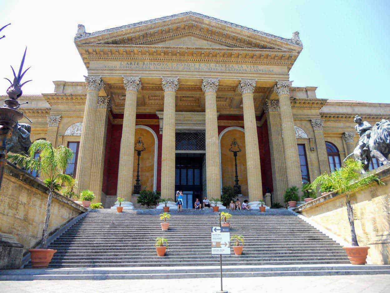 25 luoghi da visitare a Palermo e dintorni in stile arabo normanno 3 Front view of a historic classical building with grand staircase, tall columns, and intricate architectural details, ideal for exploring cultural heritage, architecture, and history.