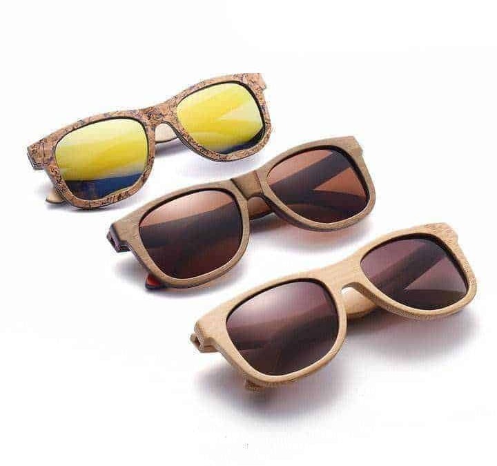Occhiali da sole in legno con lenti colorate, stile eco-friendly e moda sostenibile, perfetti per proteggere gli occhi con design alla moda, da uso quotidiano o per il tempo libero.