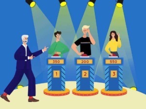 Vincitore di un quiz televisivo con premi in denaro, scena di suspense e concentrazione, premio di primo, secondo e terzo posto, pubblico coinvolto in un game show.
