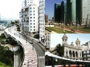 Vile moderne e antiche, skyline di città con edifici alti e tram su strada urbana, rappresentando il mix architettonico di città italiane e moderne.