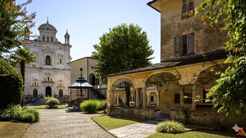 Un'immagine di un antico edificio e una chiesa storica nel centro di Milano, circondati da alberi e un giardino ben curato, con un'atmosfera tranquilla e suggestiva.
